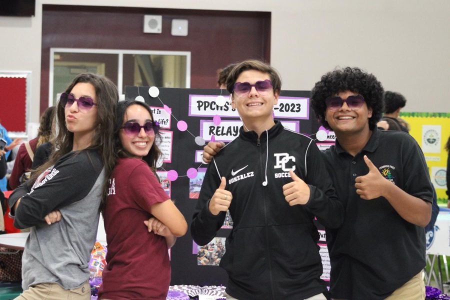 Donning sunglasses, and hoping to attract future members, the Relay for Life club promotes their mission at SGAs club fair. 