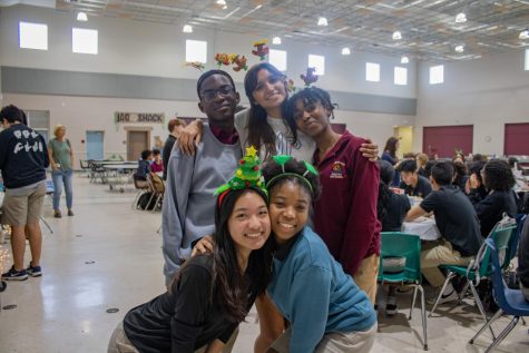 Christmas tree headbands line the heads of Student Council, the ones who made Winter Fest possible. Behind them, gingerbread house construction and delicious hot chocolate—the staples of the CO 2024 event—preview the holidays ahead.