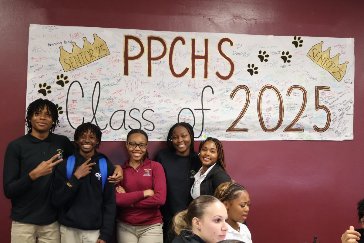 PPCHS students from the Class of ‘25 stand in front of a poster signed by dozens of other rising seniors. The Class of ‘25 has begun its final year of high school, with many new seniors excited for the bittersweet end of their school life. 