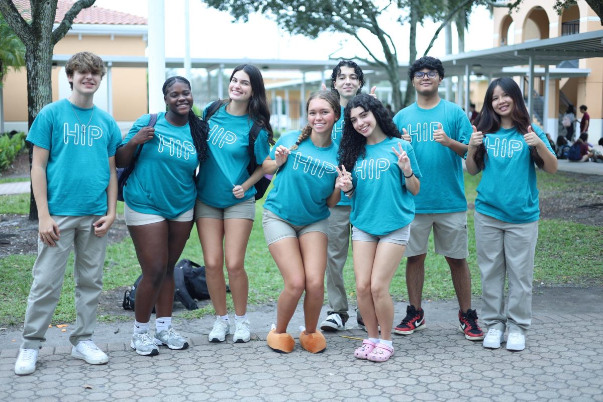 The Health Information Project (HIP) members gather for a photo in the PPCHS courtyard. HIP is part of a nonprofit organization that aims to educate high school students about their health. 