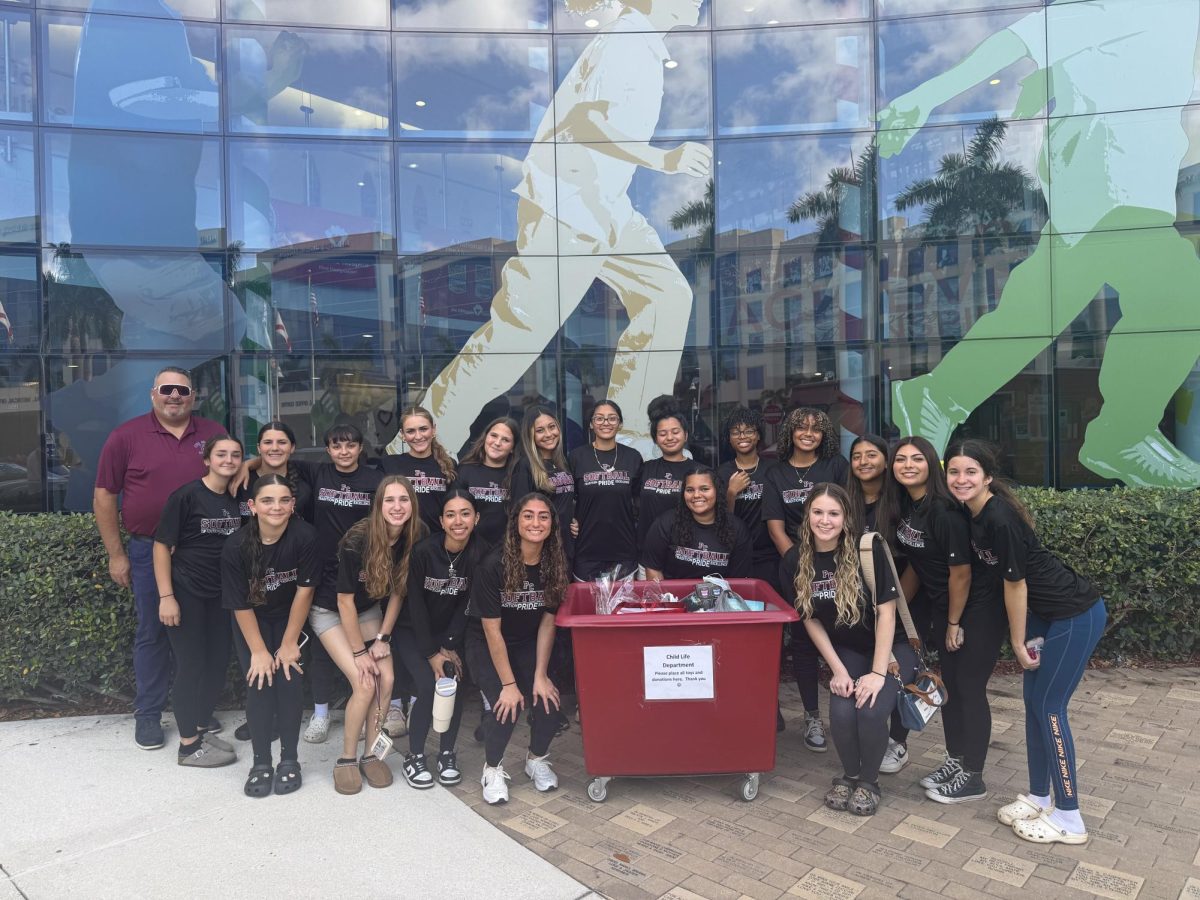 The Lady Jag softball team organizes a toy drive and comes together to share the Valentine's Day love with kids at Joe DiMaggio Hospital.