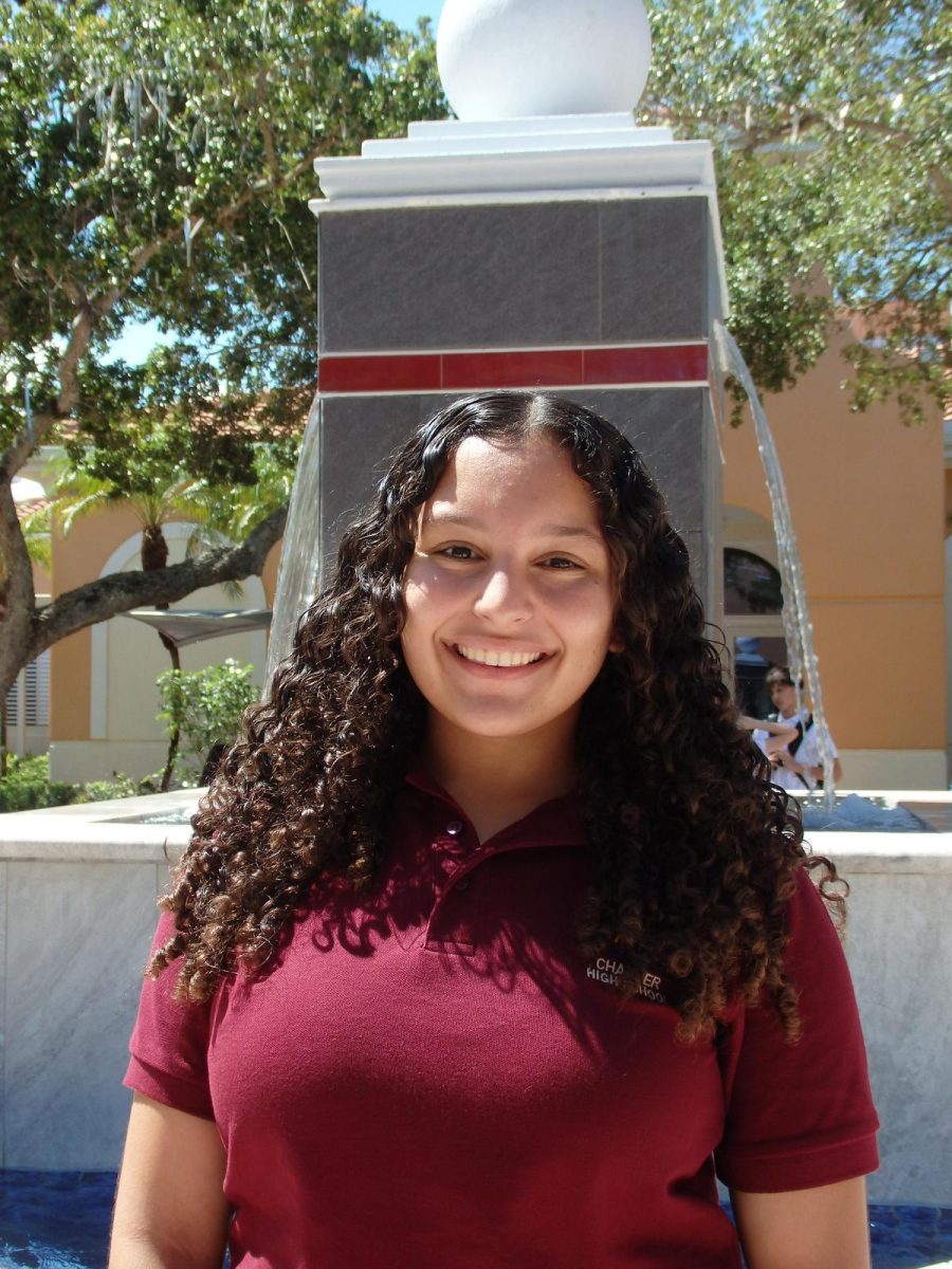 Speakers of Tomorrow President Jocelyn Perez smiling for a photo by the PPCHS fountain.