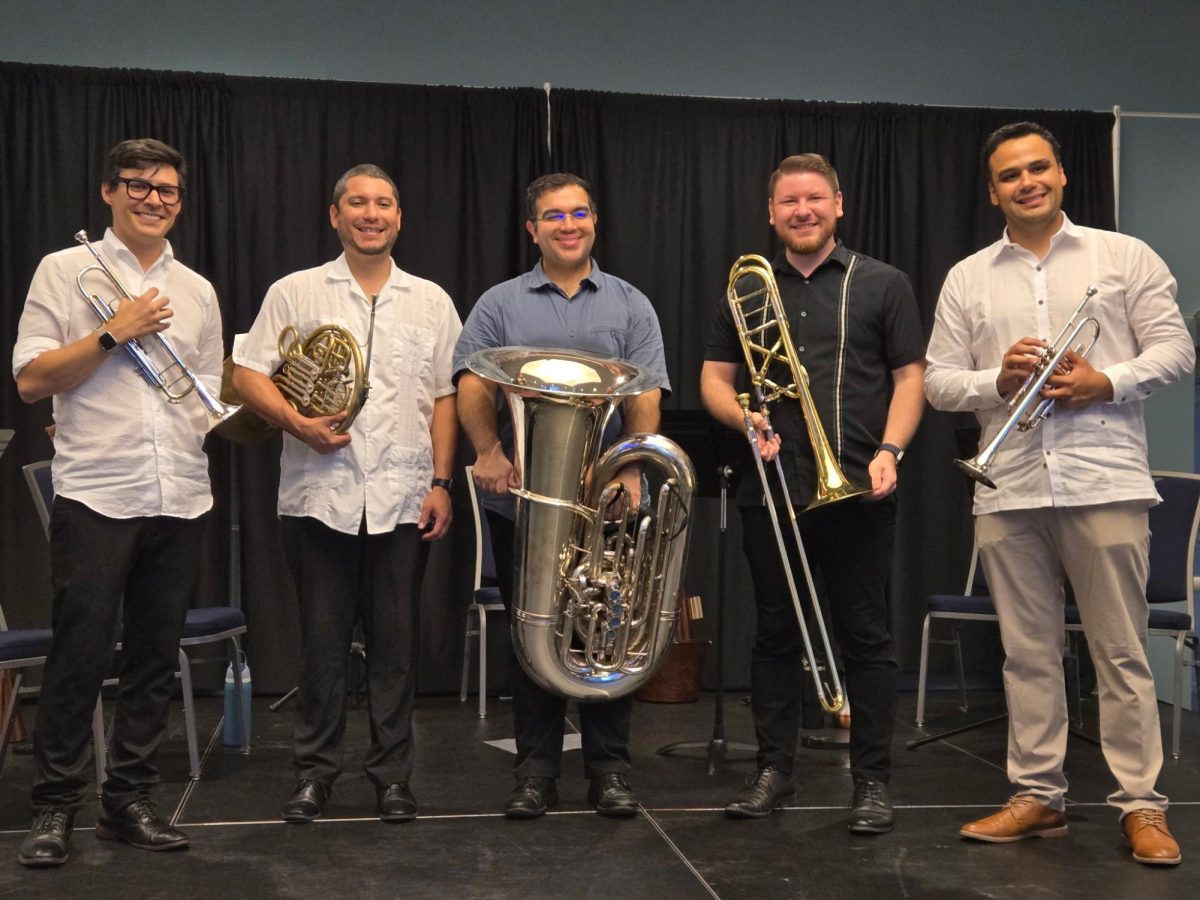 The brass quintet section of the South Florida Symphony smiles as they receive a standing ovation. 
