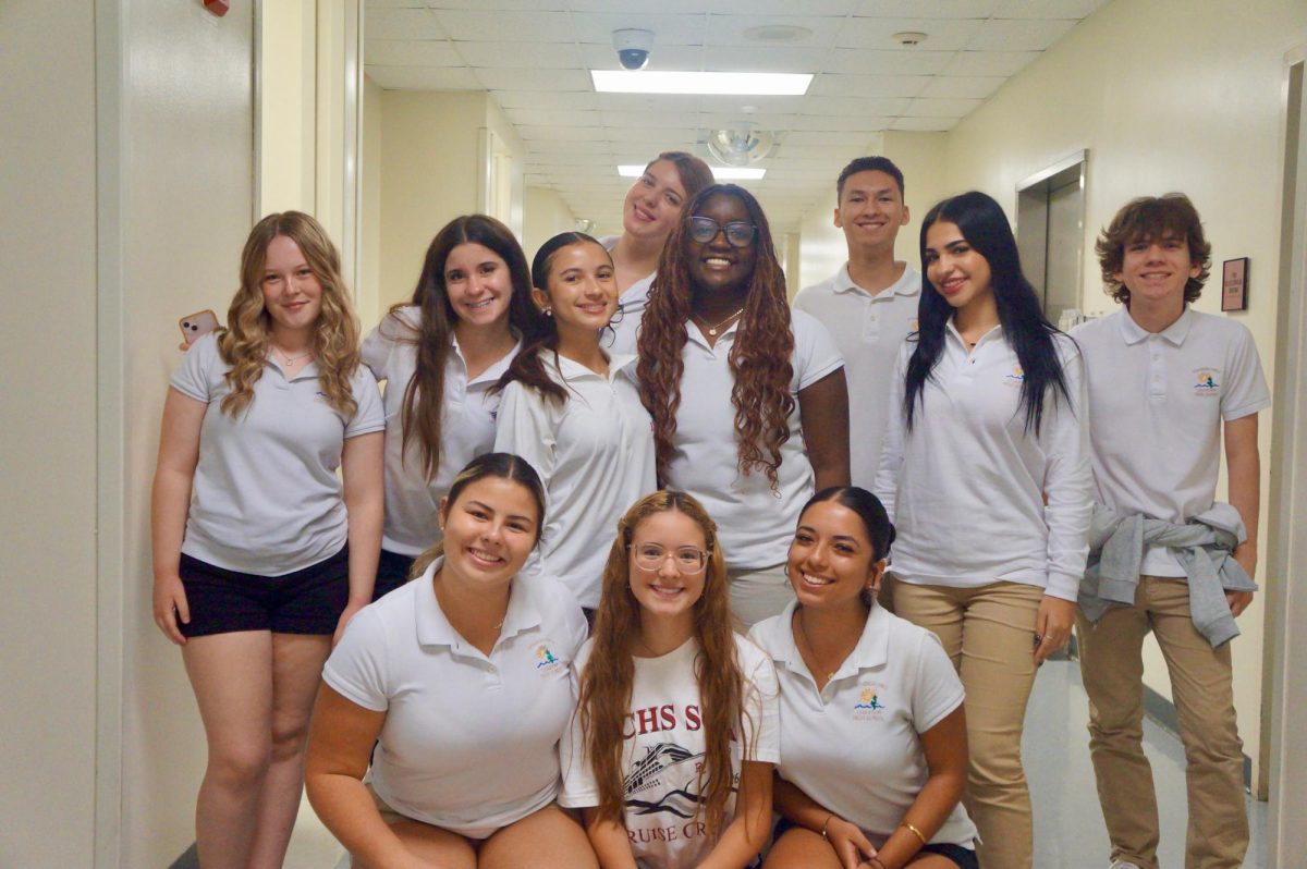 The CHAT newspaper journalism students pose warmly together while wearing white polos in celebration of Peace Week. 