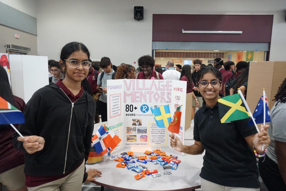 Here is the Vice President:Anjali Yalamanchi alongside her is Fundraising Director: Shreenidhi Vasudevan both representing Village mentors in Club Fair. A club where students tutor students in elementary from places across the world.