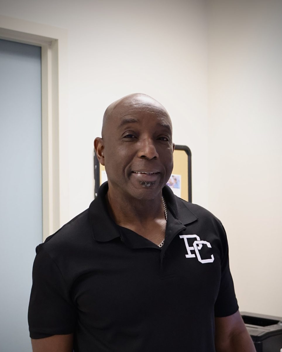 AI teacher, Mr. Maxwell, smiling at the camera.