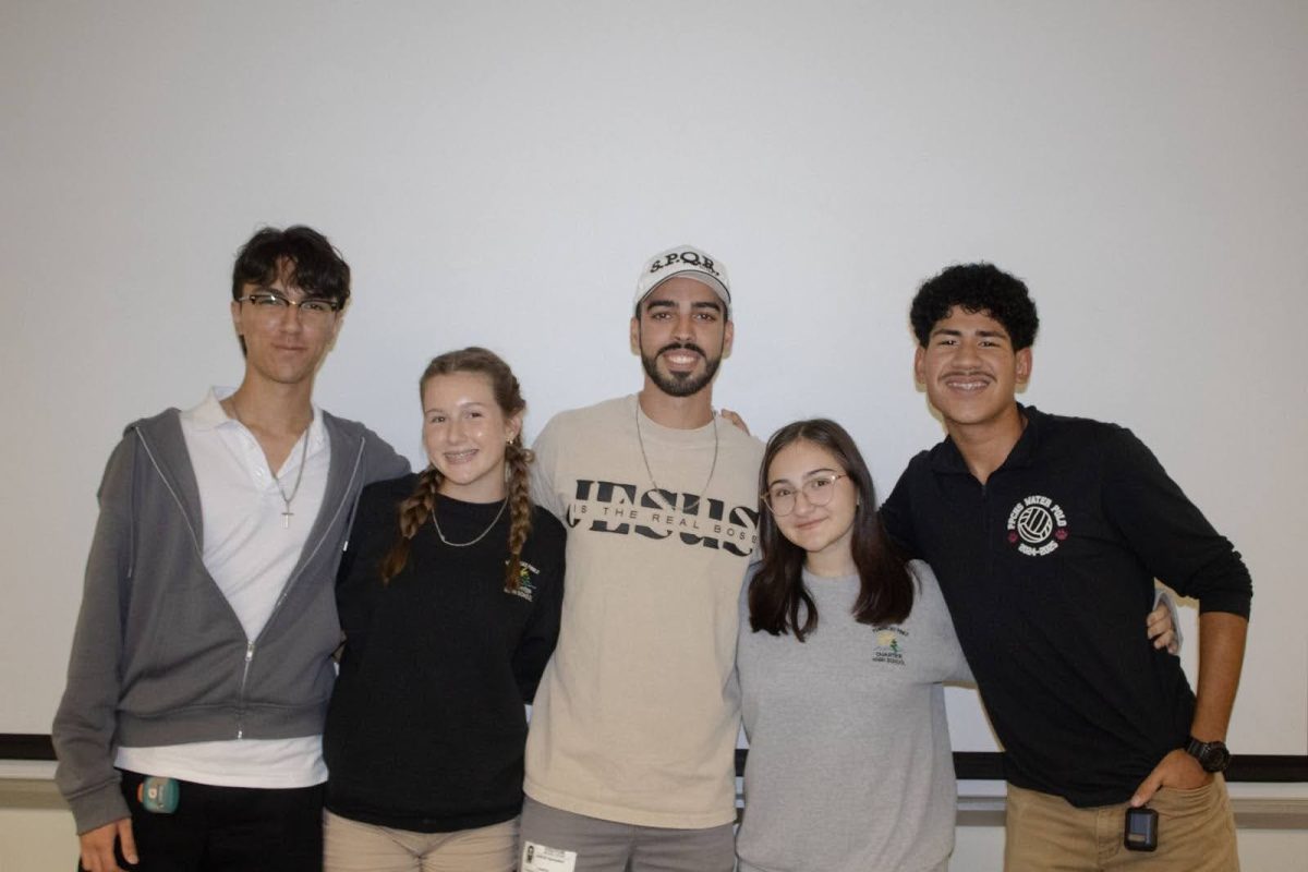 The First Priority board gets together for their weekly meetings, starting on the left with the Head of Connection, Juan Bustamante, next to him is Lyla Masson who is Head of Media, in the middle stands Adriel Gonzalez who is the clubs sponsor, on his right is Kayra Arik the clubs President, and lastly standing next to Kayra is Justin Ruiz who runs Head of Administration. They all come together with the intention of spreading God’s word to others.