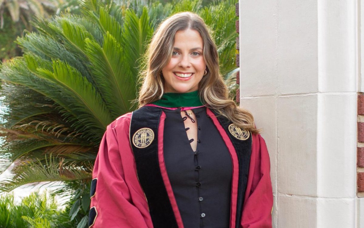 Pembroke Pines Charter alumna Nicole Batista is seen wearing her Florida State University College of Medicine graduation regalia, marking her achievement of earning a Doctor of Medicine (MD) degree.