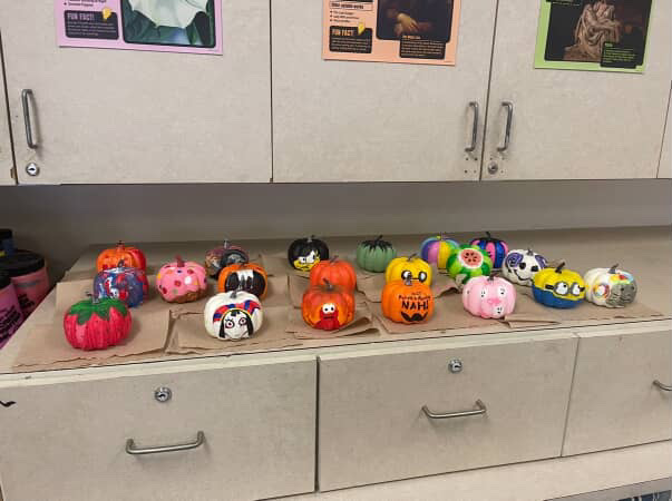 Pumpkins and paintbrushes filled up the classroom at the NAHS Pumpkin Painting meeting