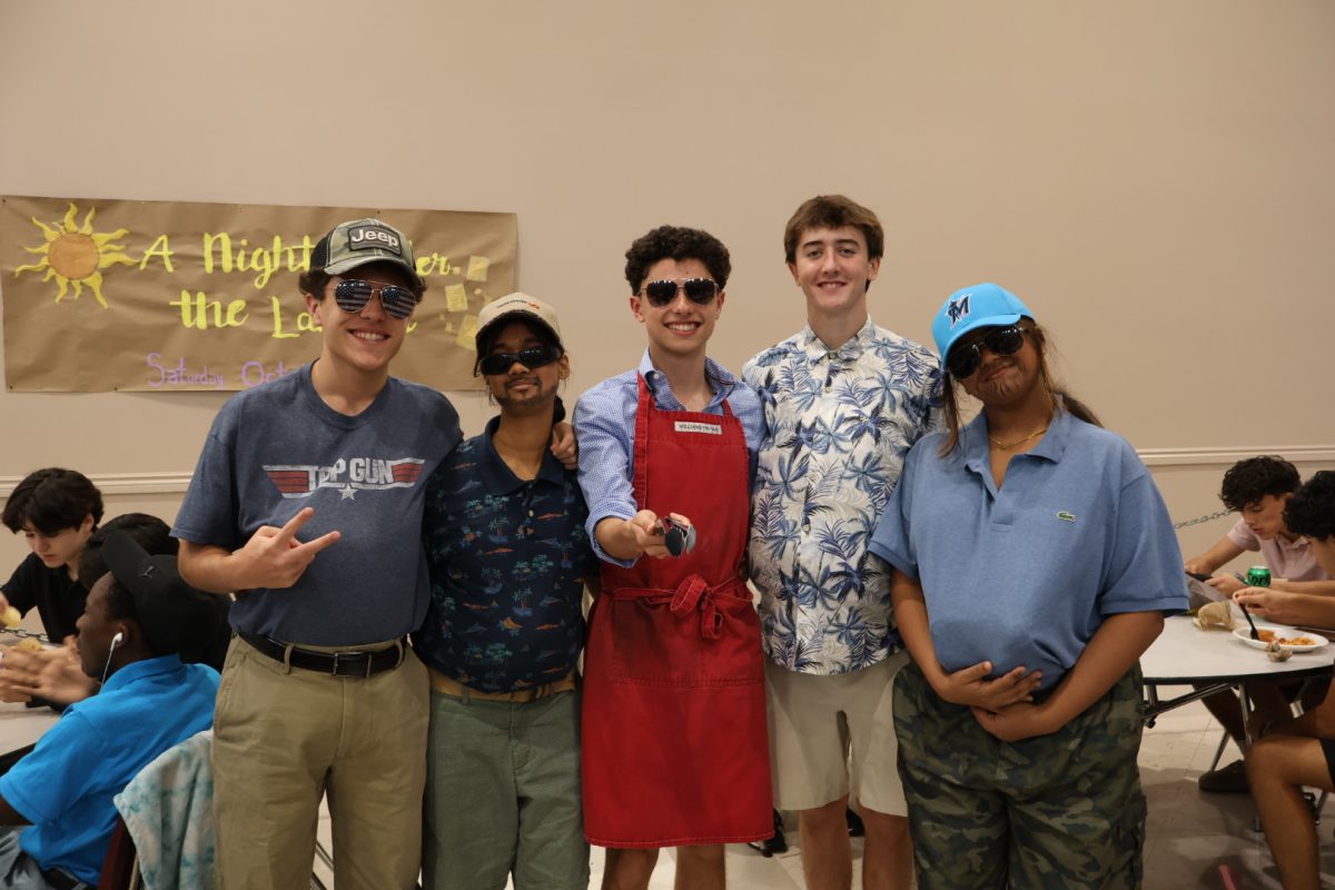 A group of barbecue dads channel their inner middle-aged man for Day 2 of Spirit Week.
