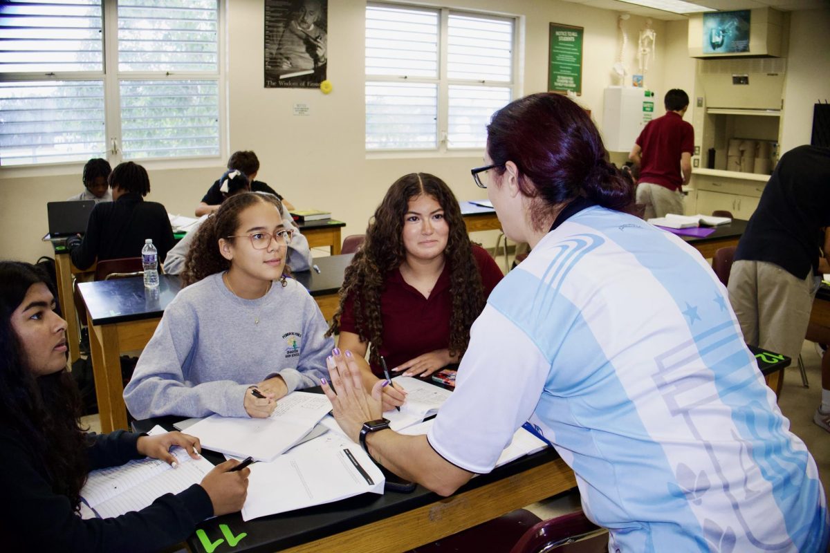 Former AICE Biology teacher Mrs. Pardo teaches underclassmen in chemistry. By focusing on different students' needs and working with them face-to-face, she ensures lessons are interactive and effective.