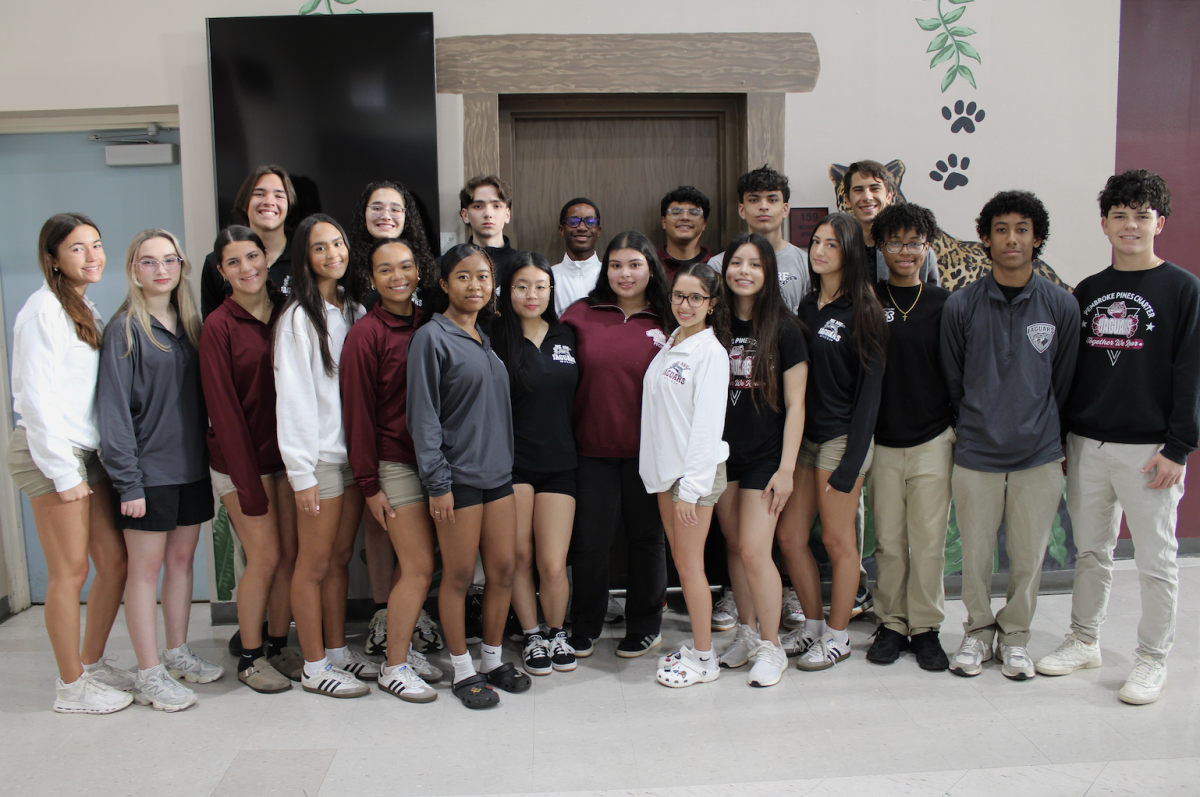 Jag Shack staff standing all together in front of the camera excited to start a new year with their new products and technological advancements.
