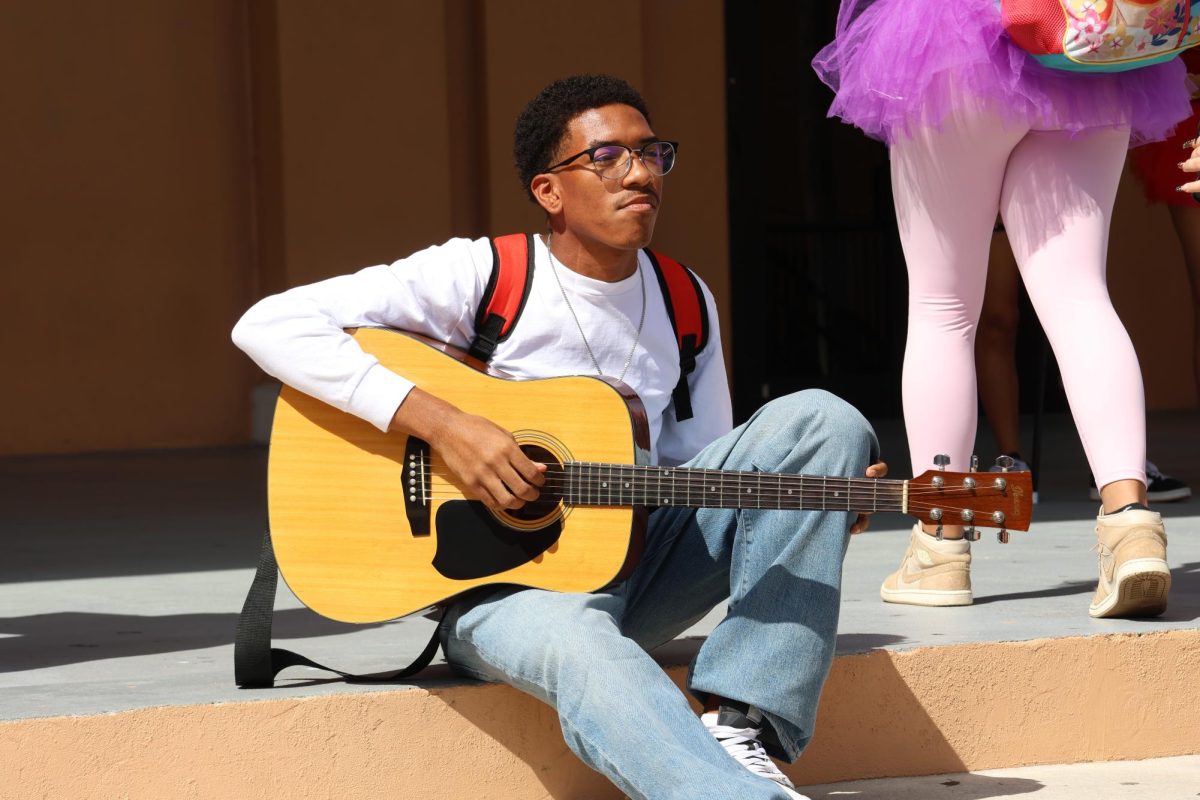 This PPCHS student was seen without his twin. Maybe he is part of a performative duo, hence the acoustic guitar.
