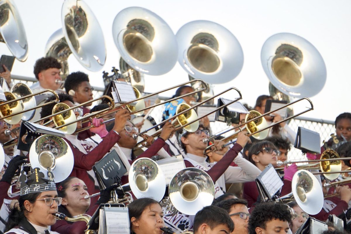 The Pembroke Pines Charter High School Band playing their hearts out at their last football game of the season during the first drive of the game.