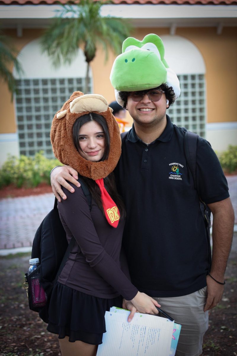 Two students dress up as Nintendo characters Donkey Kong and Yoshi in their interpretation of Game Day.
