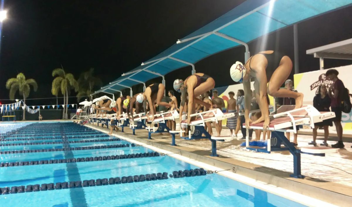 The Jaguar's swim team lining up as they prepare to race at their last home meet of the season, in other words senior night.