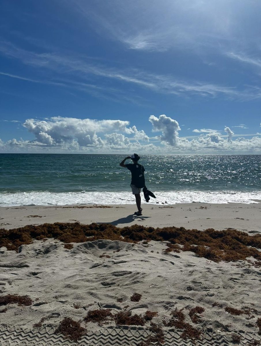 Seff Cotterell stands on the beach with her garbage bag, prepared for a long day of cleaning the environment.