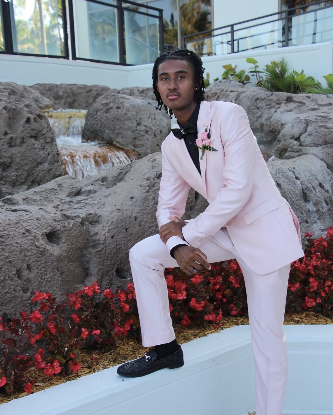 Johnson is dressed in a pink suit for his 2025 prom. This outfit corresponds with the "beauty" part of his superlative. Johnson was admitted to an Ivy league school, and he now attends the University of Florida.