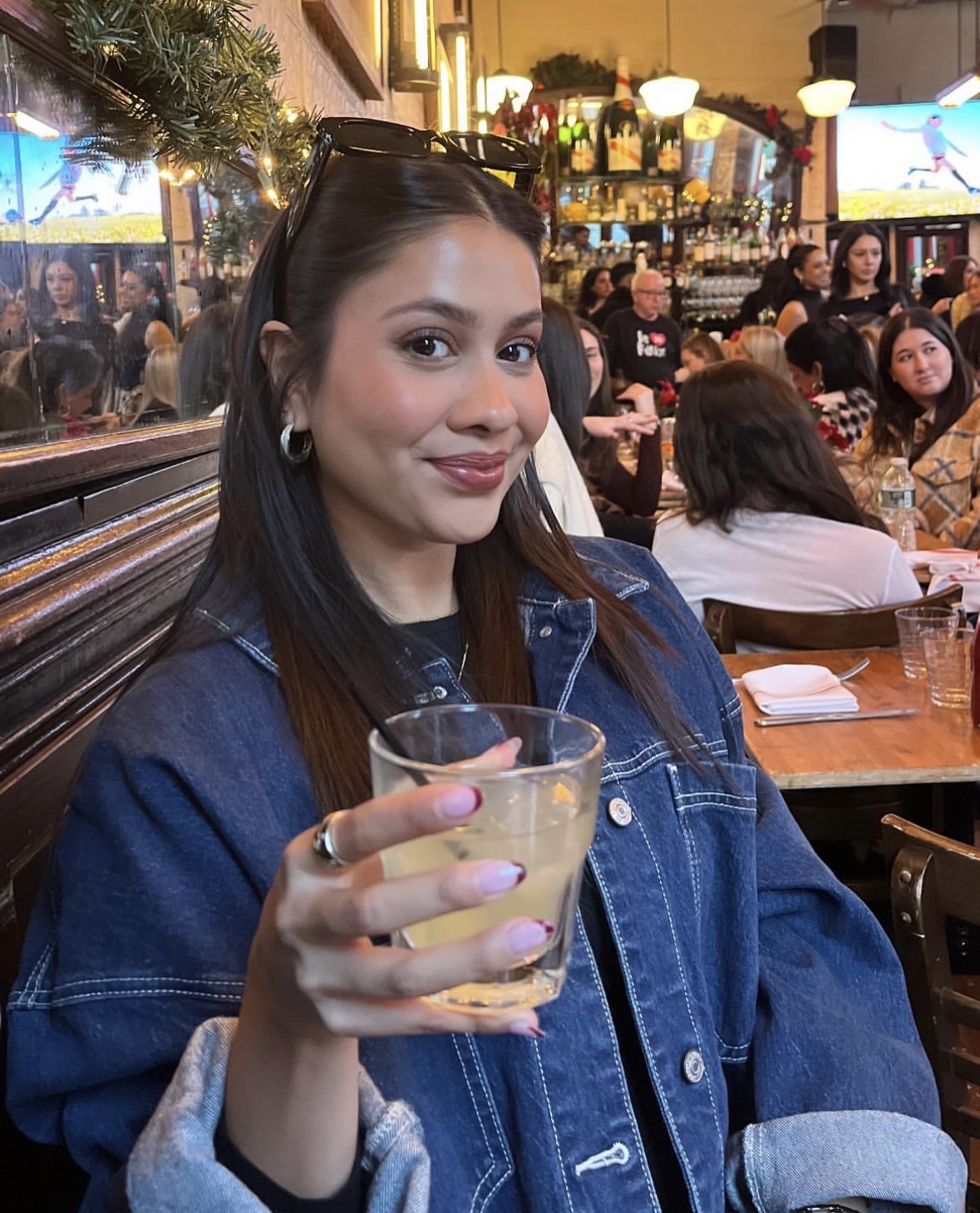 Garcia shows the camera her drink, while at a restaurant. This image shows her kind spirit, supporting her superlative.