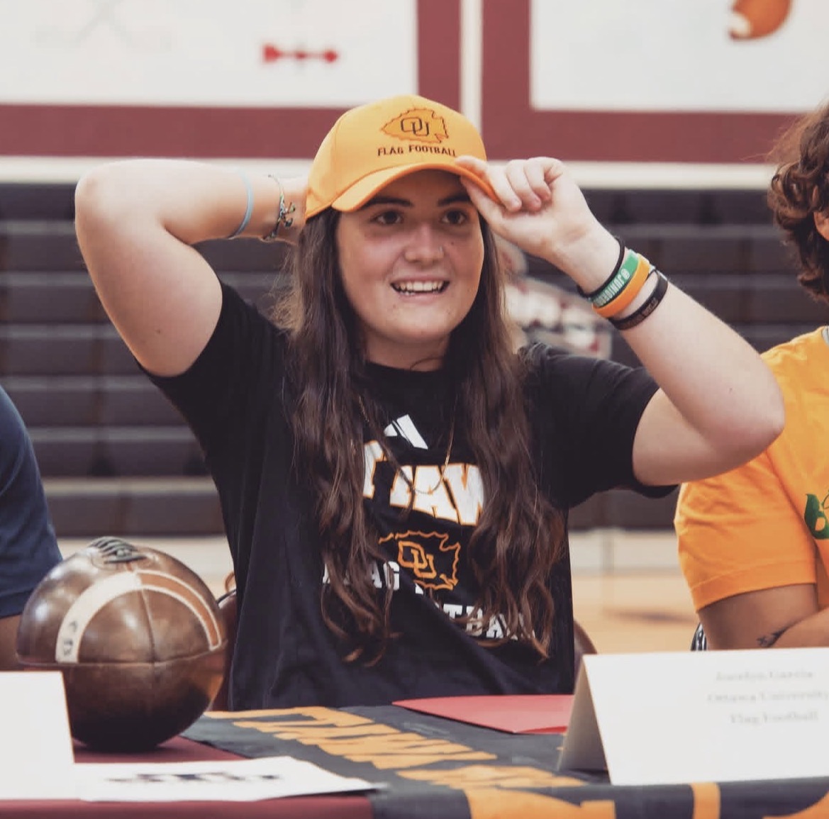 On Signing Day, Garcia put on a hat with her school's symbol, signifying the next chapter of her life.