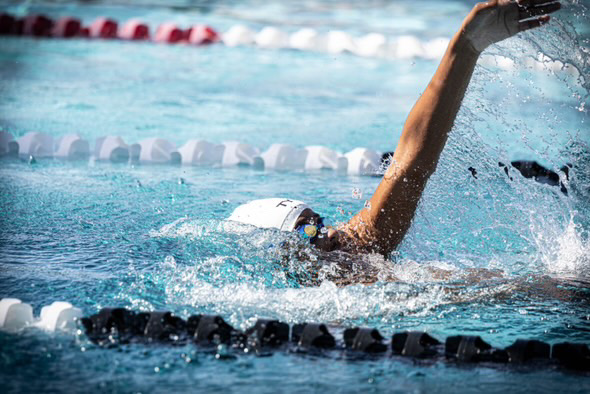 Senior Dominic Thompson as swims to the finish line without knowing that this is his last high school meet ever.