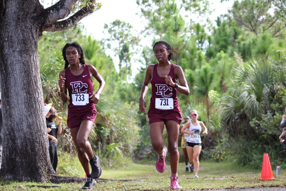 The Lady Jags Cross Country runners as they sprint to the finish line with the main goal in mind: states.