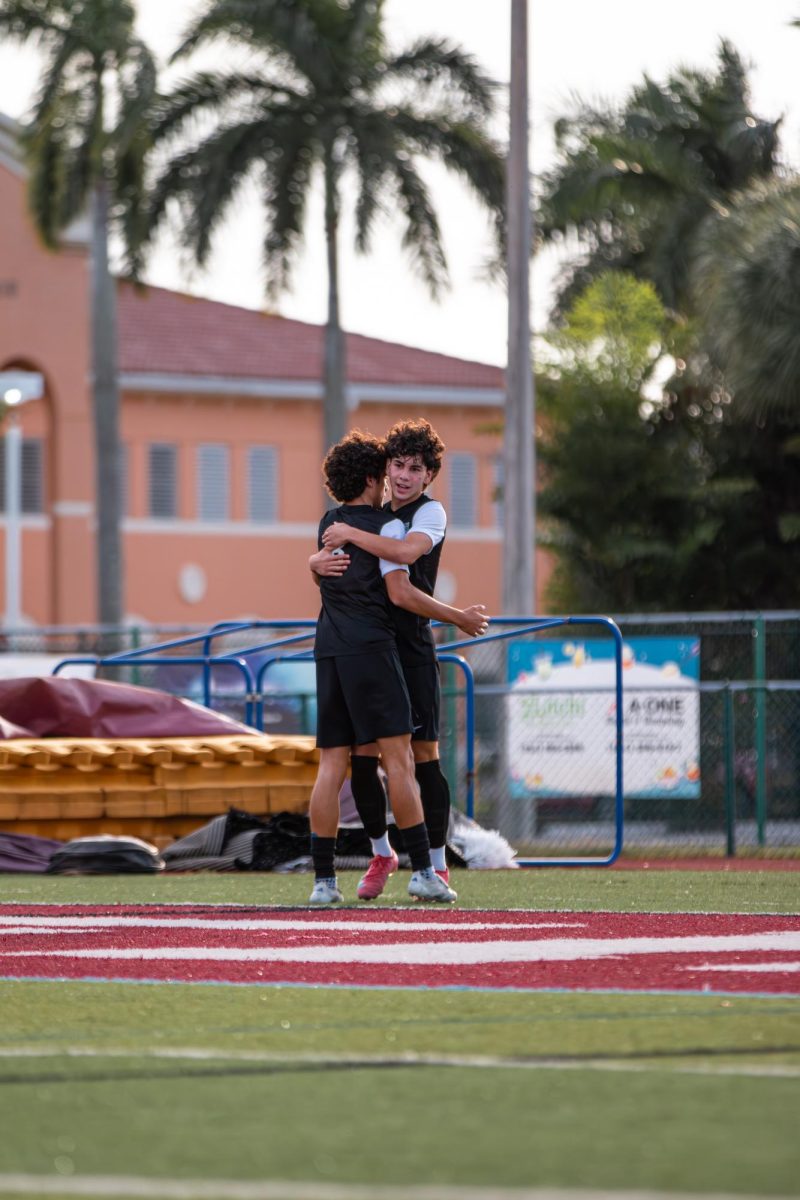 The Jaguars having a heartfelt moment prior to senior Julian Iodice scoring a goal as he roars through his final soccer season as a Jaguar.