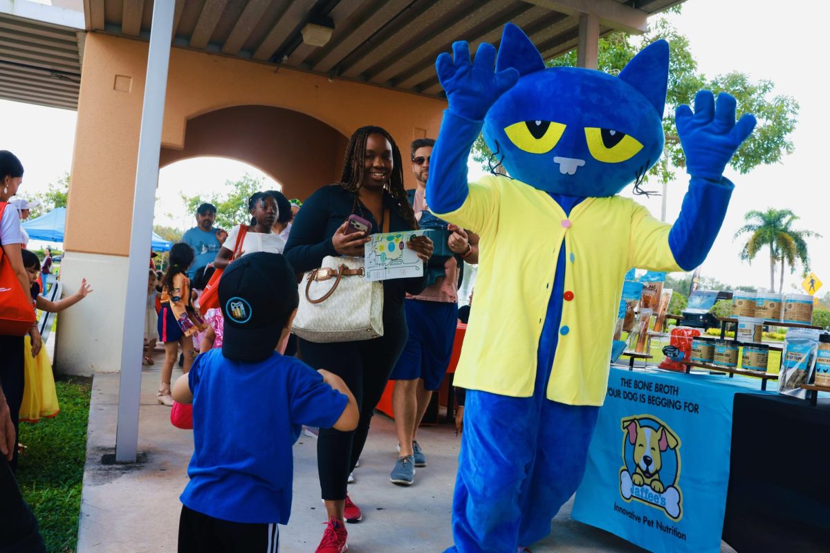 A library employee dresses up as Pete the Cat from the popular kids book series. This is one of the many people who dressed up characters from a novel.