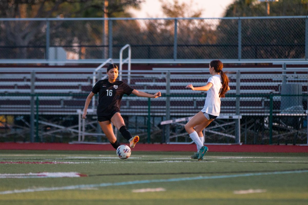 Junior Taliyah Gavilanes [#16] as she attempts to stop the soccer ball from going to the opponent, potentially saving her team from the opponents scoring a goal. 