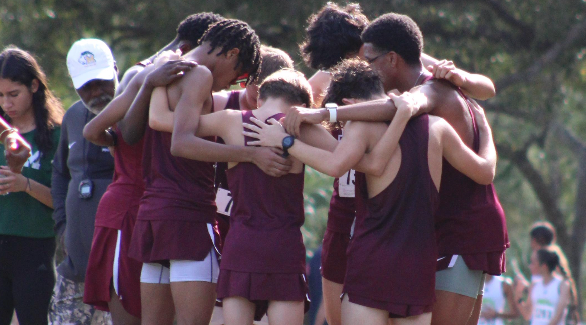 The Jags boy's cross country team as they huddle before their meet as their main focus is becoming state champions.