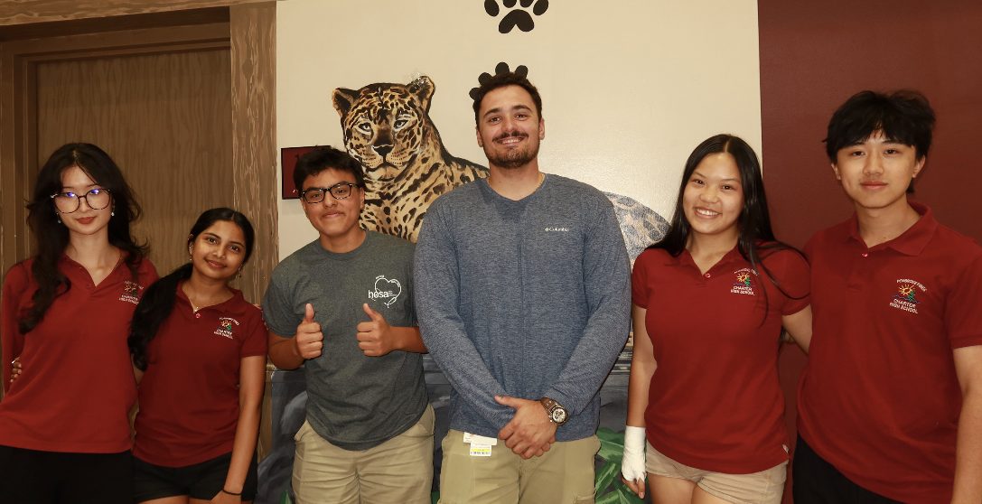 PPCHS Recover and Rise Team and Trainer John from Memorial Hospital pose and smile for the camera at the Wrapping event. Starting from the left is Megan Chin, Reyna Kannan, Diego Ponce, Trainer John, Pia Alan, and Ryan Zhou.