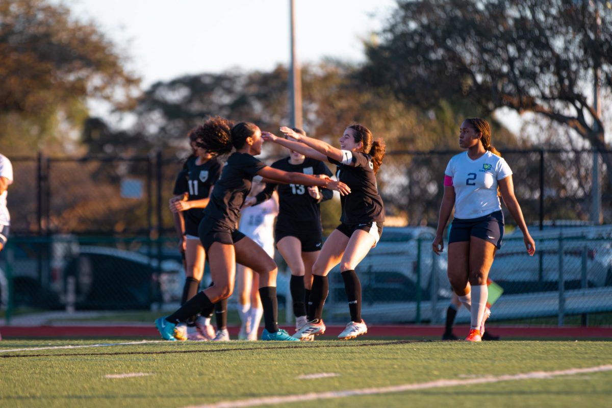 Seniors Catalina Castro [right] and Amariah Ayum [left] hug each other after Castro scored a goal.