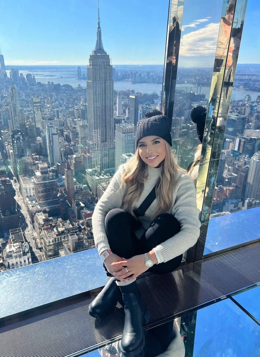 Michelle Maranchello (pictured) sits at an observation deck overlooking New York City during a work-related trip.