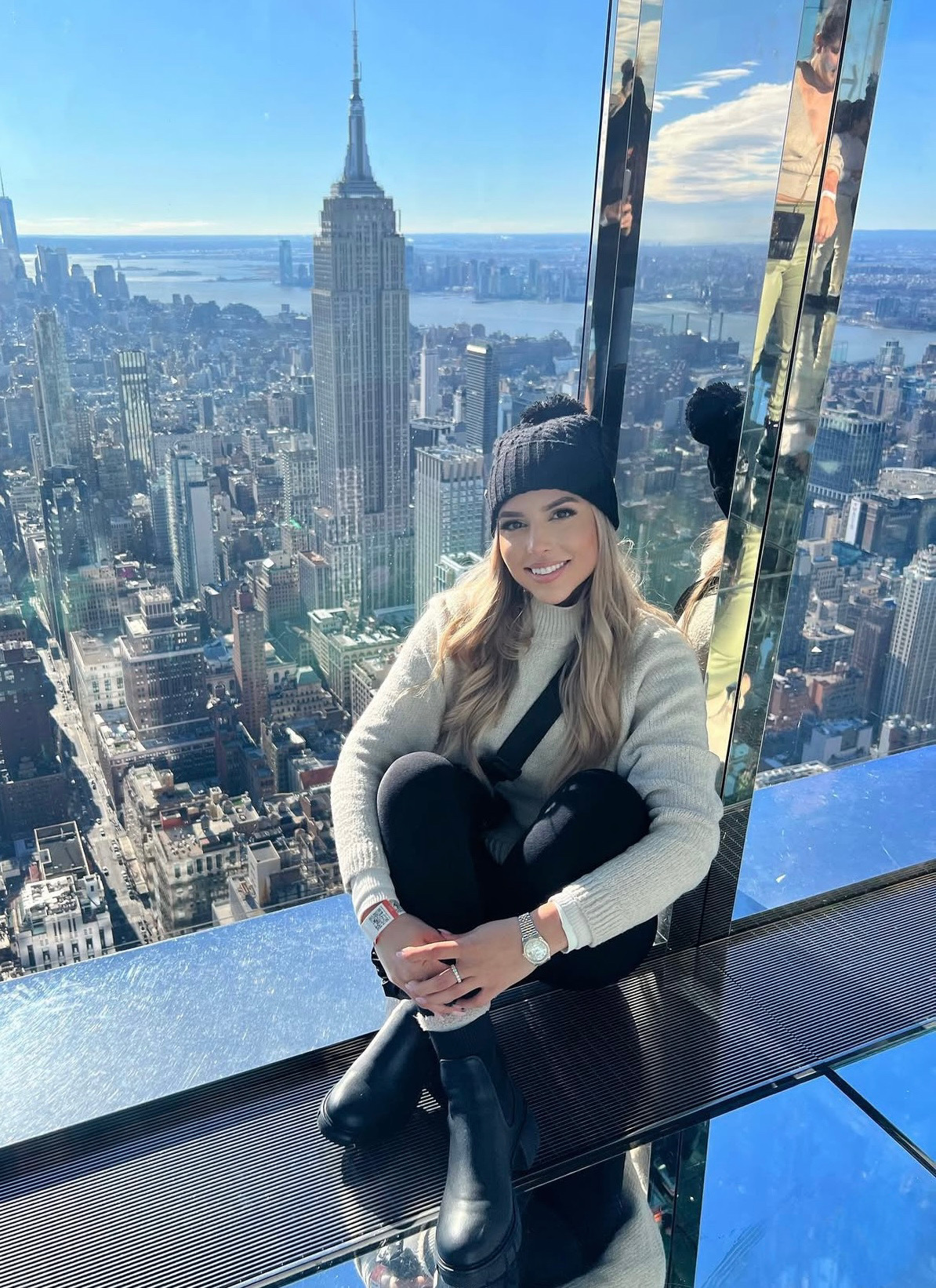 Michelle Maranchello (pictured) sits at an observation deck overlooking New York City during a work-related trip.