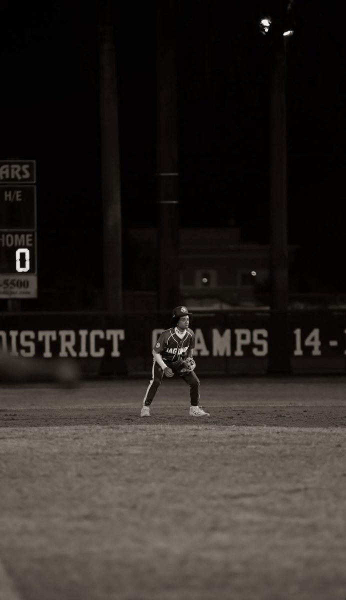 Velazquez as he sets his feet while the pitcher winds up, preparing for what comes next.