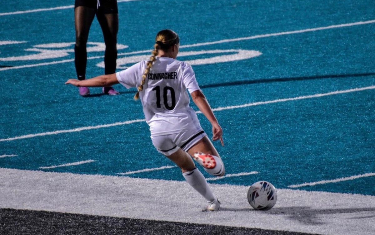 Madison Connacher as she kicks the ball off during a game.