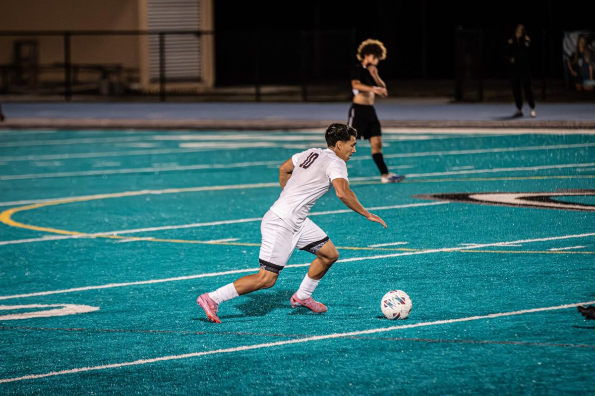 Senior midfielder Gabriel Calderon (#10) stepping with power as he gets ready to make a run through the midfield. 