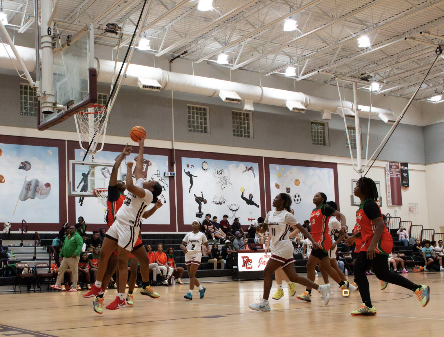 Sophomore Marai Osborne [#20] attempts to make a layup to assist in a Lady Jag Victory.