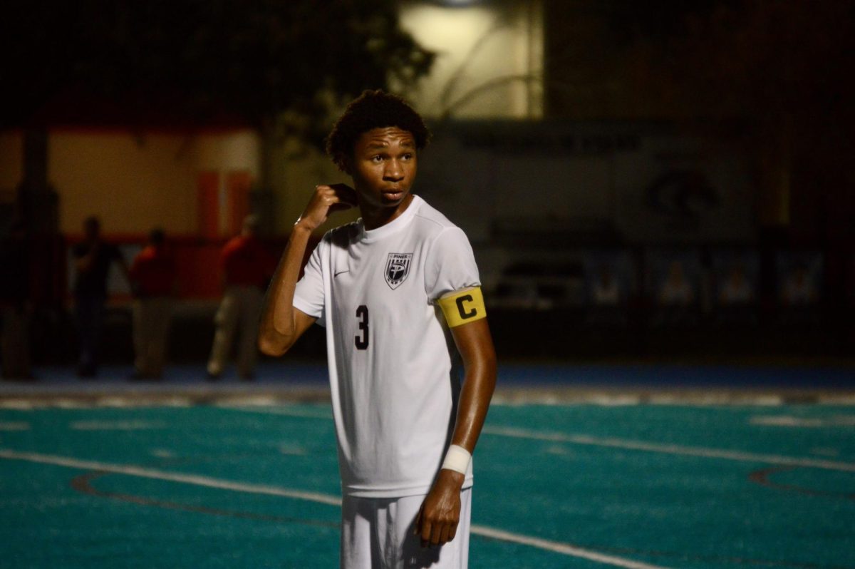 Senior Noah Lewis stands on the field as a Jaguar ready to dominate the other team.
