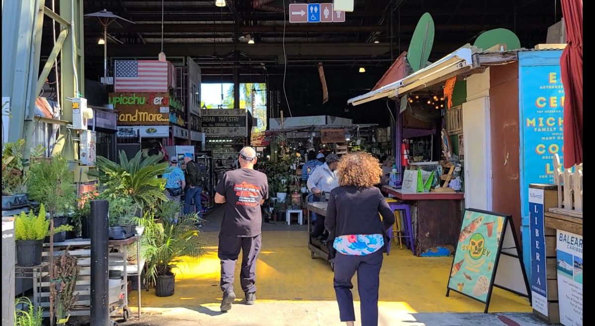 One of the entrances to the Yellow Green Farmer's market, highlighting the different vendors and the mixing of cultures here in South Florida.