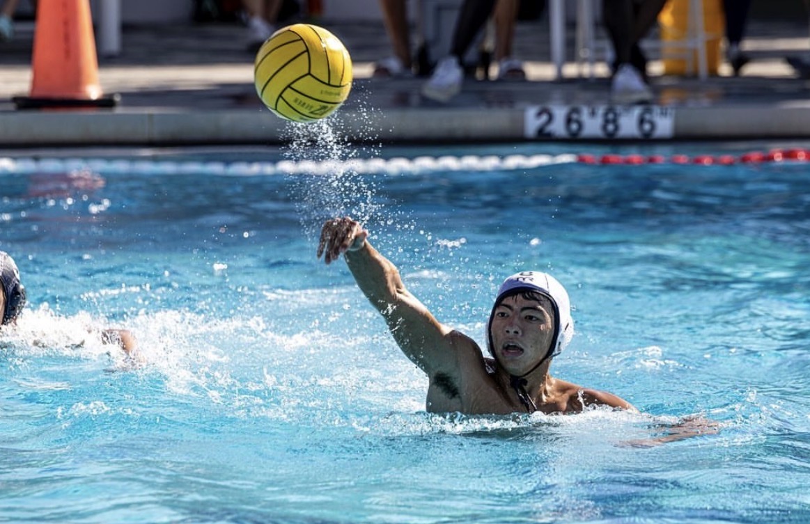 Capiro throwing the water polo ball at the goal during his high school years. 