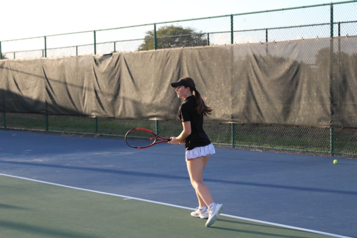 Junior Lyla Masson on the prowl waiting for the tennis ball to be served.