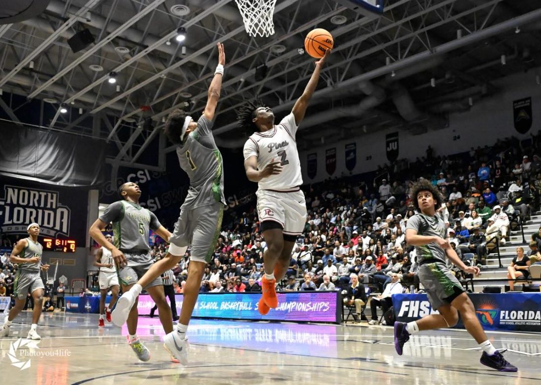 Junior Zacuras Dawson makes a layup in the state championship game, leading the Jaguars to victory.
