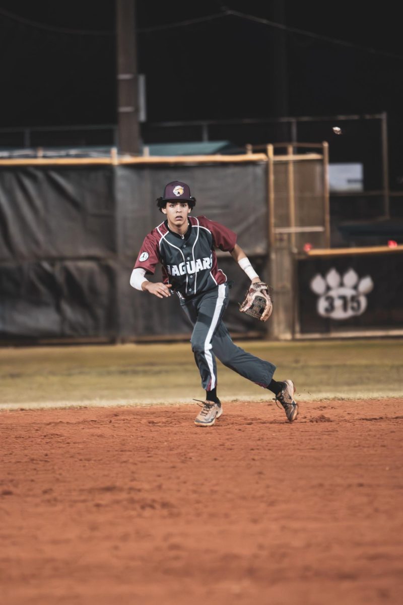 Sophomore Liam Caban shuffles his feet, positioning himself to field the ball.