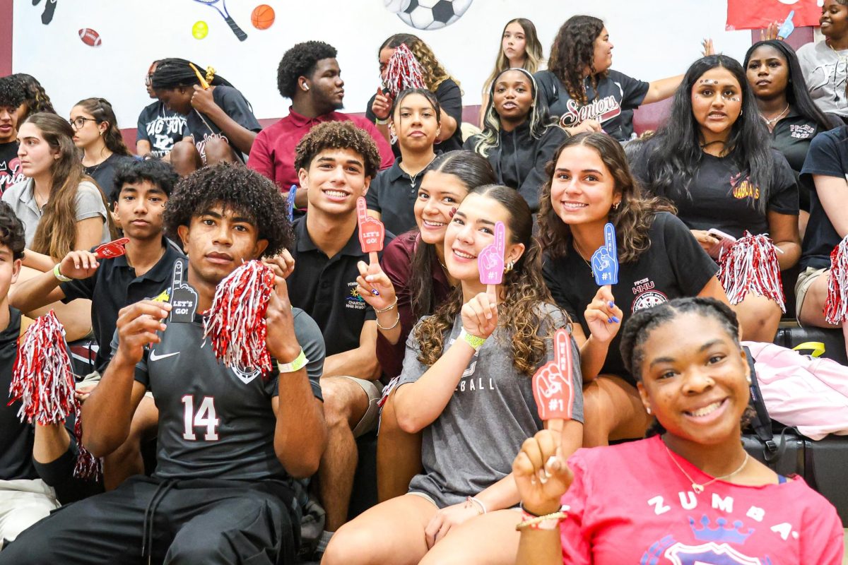 PPCHS seniors hold up pom-poms and foam fingers, ready to celebrate the many clubs and teams at the spring pep rally.