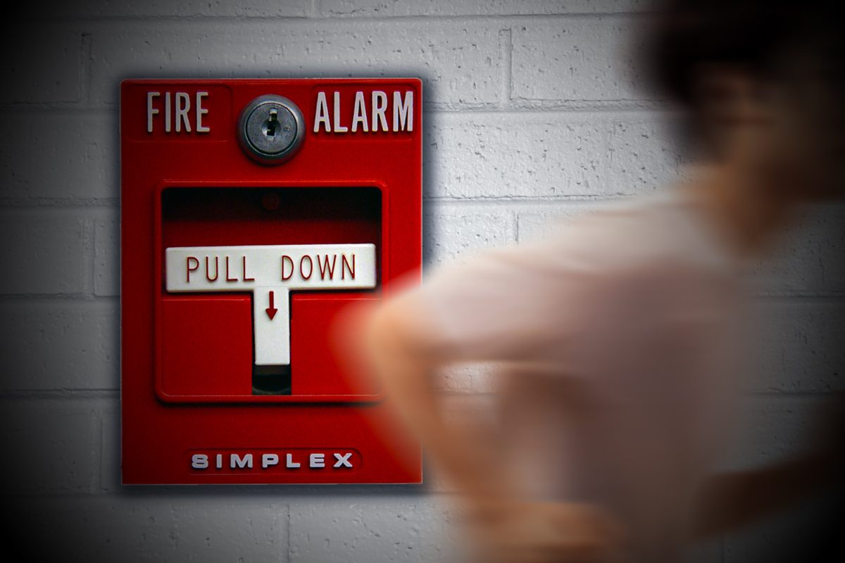 A graphic depicts a student running after a fire alarm was pulled. The fire alarm, pulled by a student, was mistaken for a lockdown, and many were injured trying to escape campus.
