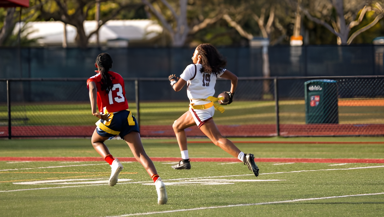 Senior Kameron Dacosta (#19) runs with the football after she catches it to make a touchdown.