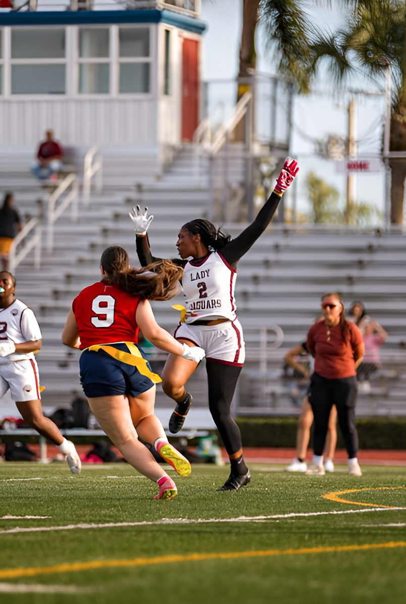 Senior Brianna Barbee (#2) jumps in the air to try and intercept the pass.