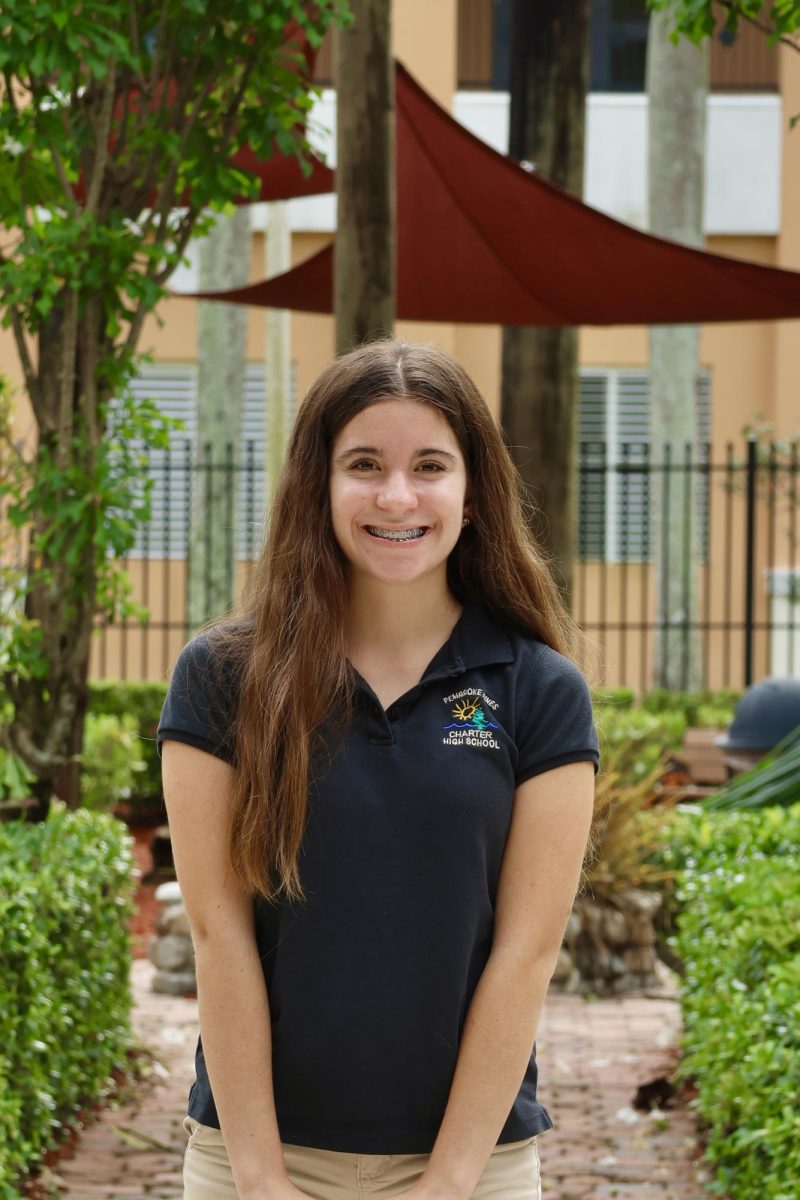 Junior Daisy Ferguson smiling at the camera for her CHAT staff picture.