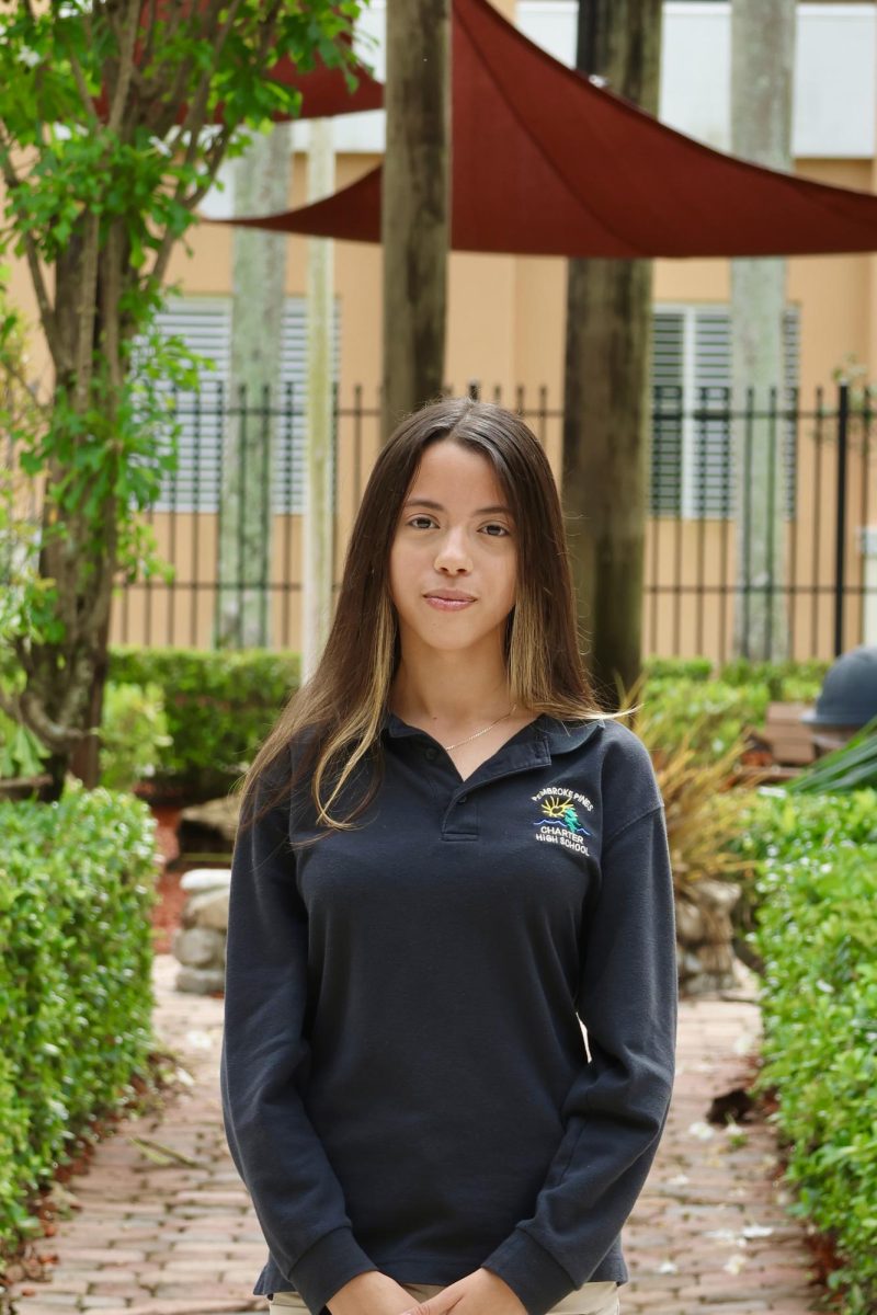 Junior Loraine Sanchez Figueroa smiling at the camera for her CHAT staff picture.
